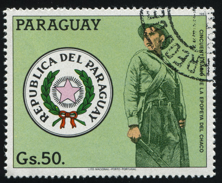 RUSSIA KALININGRAD, 19 APRIL 2017: stamp printed by Paraguay, shows the soldier and the emblem, circa 1983のeditorial素材