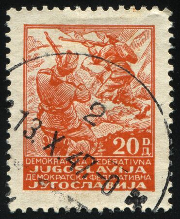 RUSSIA KALININGRAD, 12 NOVEMBER 2016: stamp printed by Yugoslavia, shows partisans, circa 1945のeditorial素材