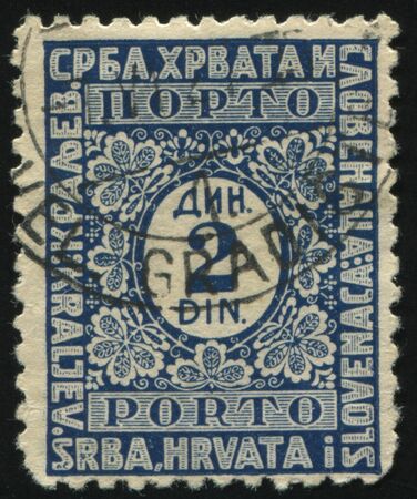 RUSSIA KALININGRAD, 12 NOVEMBER 2016: stamp printed by Yugoslavia, shows the ornament with the number in the thentre, circa 1921のeditorial素材