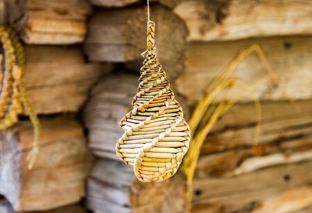 Old country toy made of straw. Rural mascot. Summer season.の写真素材