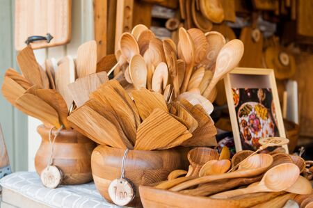 Handcrafted wooden dishes. Village Market. Sale of dishes.の写真素材