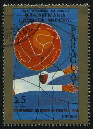 RUSSIA KALININGRAD, 19 APRIL 2017: stamp printed by Paraguay, shows poster devoted to soccer championship, circa 1954のeditorial素材