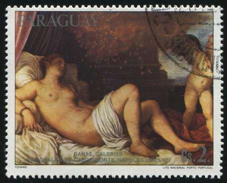 RUSSIA KALININGRAD, 19 APRIL 2017: stamp printed by Paraguay, shows Painting  Danae by Titian, circa 1985のeditorial素材