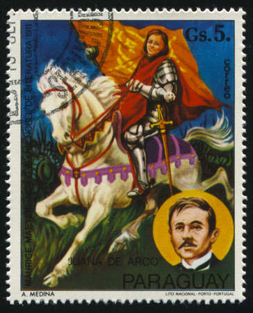 RUSSIA KALININGRAD, 19 APRIL 2017: stamp printed by Paraguay, shows Painting of Jeanof Arc and a portrait of Maurice Maeterlink by Medina, circa 1977のeditorial素材