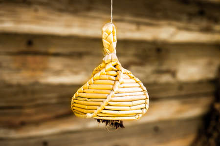 Old country toy made of straw. Rural mascot. Summer season.の写真素材