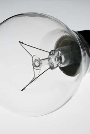 Close-up of a bulb with low saturation and very sharp focus. An universal symbol of light, human...