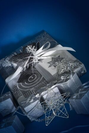 Composition of silver christmas objects on blue background.の写真素材