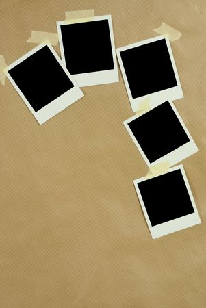 Blank Polaroid Frames on Brown paper backgroundの写真素材