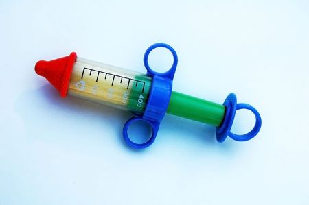 Closeup of an isolated toy syringeの写真素材