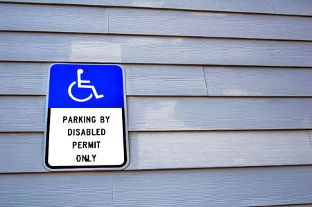 handicap sign on a wooden wallの写真素材