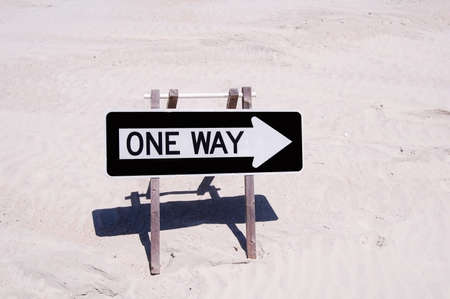 one way sign on a beachの写真素材