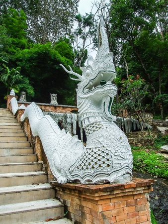 Thai Art, Single Naka statue on staircaseの写真素材