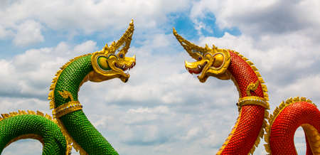 The dragon is a legendary creature Buddhism wth blue sky.の写真素材