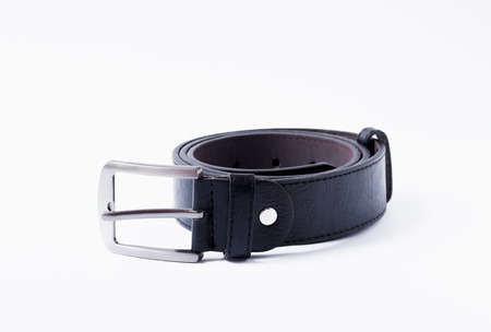 Men's black leather belt on white background.の写真素材