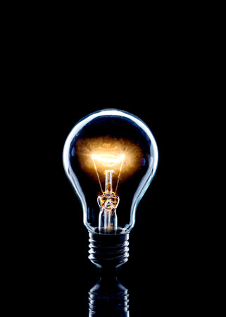 Light bulb on bright with black background.