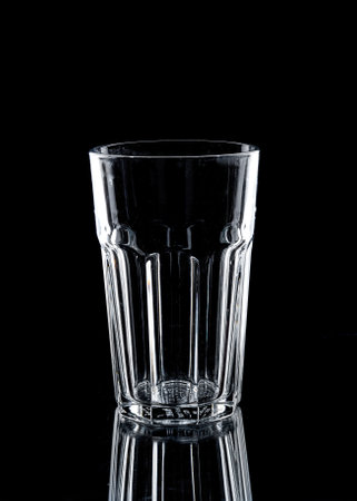 A glass of water on black background.の写真素材