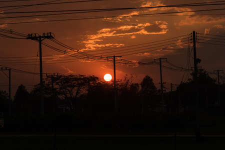 disorder of electrical wires in sunset timeの写真素材