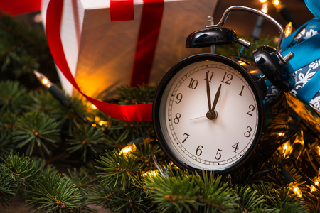 Christmass tree, gifts, lights and clockの写真素材