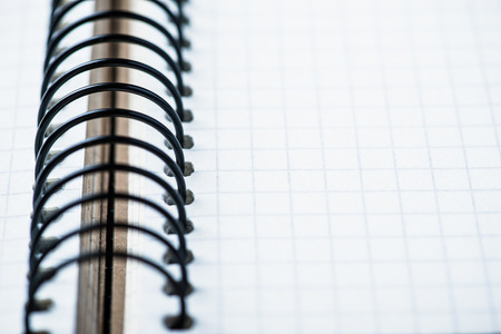 Blank spiral notebook on an oak wood table