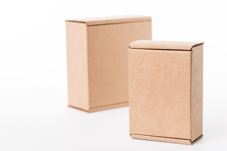 Brown cardboard boxes stacked over the white backgroundの写真素材