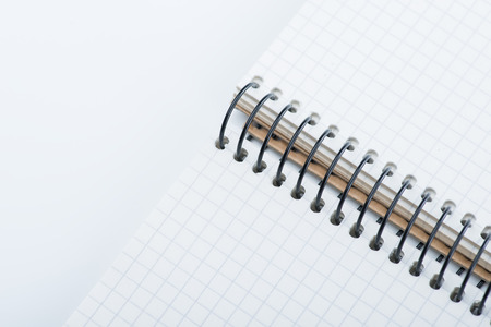 A spiral notebook over the white background