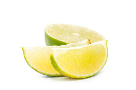 Sliced fresh limes on over white background, DOFの写真素材