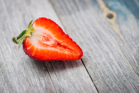Fresh and sweet natural strawberry on a rustic wooden tableの写真素材