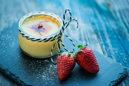 Fresh and healthy natural yogurt with berries on a rustic wooden table