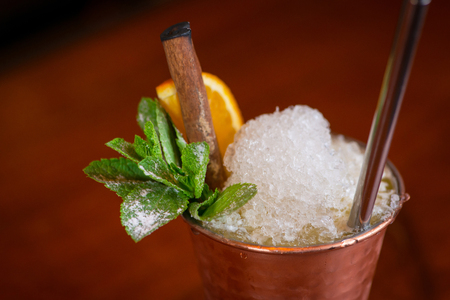 Cocktail. Mint Julep drink with orange in copper glass and steel strawの写真素材