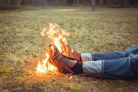 Burning shoes. Abstract composition of old  burning shoes