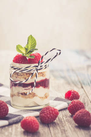 Parfait. Raspberries with greek yogurt and granolaの写真素材