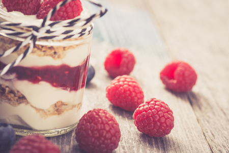 Parfait. Raspberries with greek yogurt and granolaの写真素材