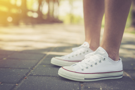 Walking. Woman walking around in the park in canvas shoesの写真素材
