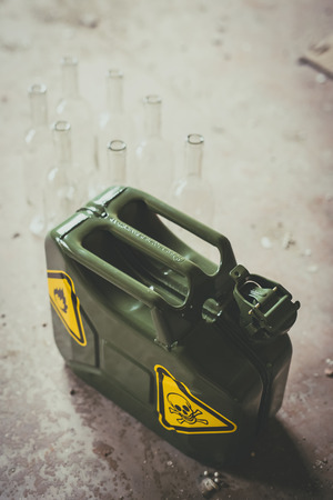 Terrorism. Molotov cocktail. Green military jerrycan with empty bottles and clothの写真素材