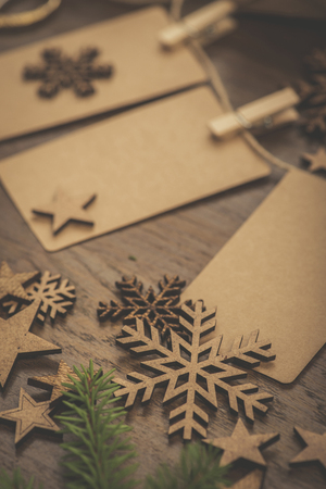 Christmas. Gifts. Cardboard vintage name tags on a stringの写真素材