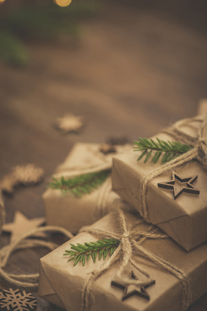 Christmas. Gifts. Vintage style gift boxes on a rustic wooden tableの写真素材