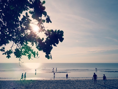 In the morning, Silhoette of tourist playing sea and walk on the beach with sunlight,Hua Hin beach...