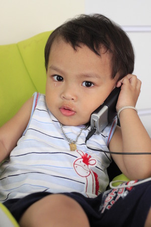 Boy on Phoneの写真素材