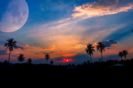 Sunset with big moon in summer seasonの写真素材