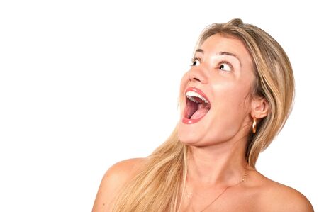 Isolated beautiful blond girl smiling and screamingの写真素材