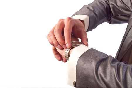 Man's hand in the suit pointing on his watchの写真素材