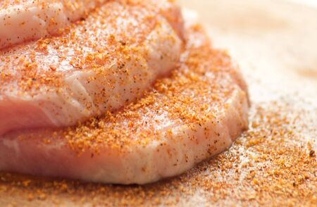 Tasty chunks of pork on the broad with spicesの写真素材