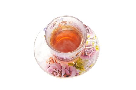 Isolated on white cup of hot tea on the saucerの写真素材