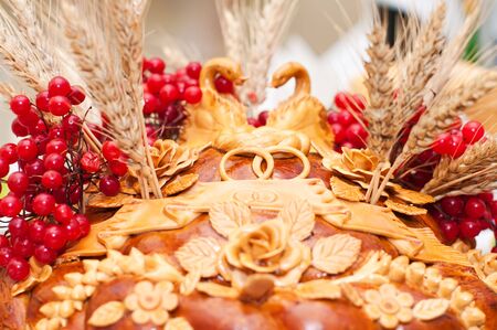National wedding loaf with guelder-rose, swans, rings and saltの写真素材