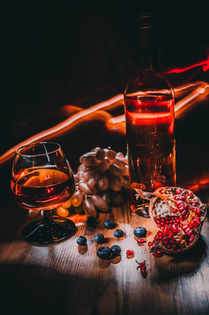 Still life with wine and pomegranateの写真素材