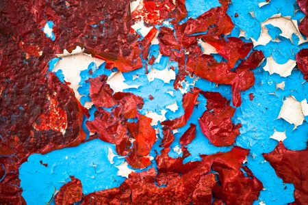 Blue-red-white cracked oil-painted surface with rich textureの写真素材