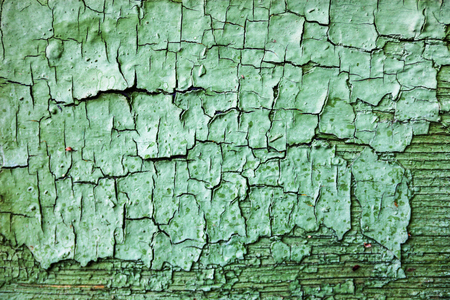 Rich wooden surface with cracked green paintの写真素材