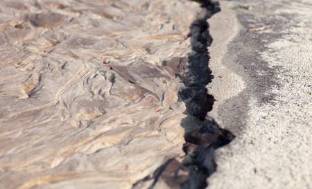 Sand surface after the rain with the relief formed by water currents.の写真素材