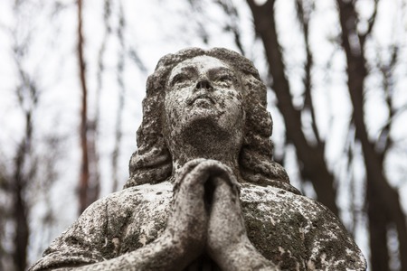 Old cemetery marble sculpture of the angel.の写真素材