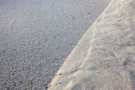 Gray sand surface with rich and various textureの写真素材